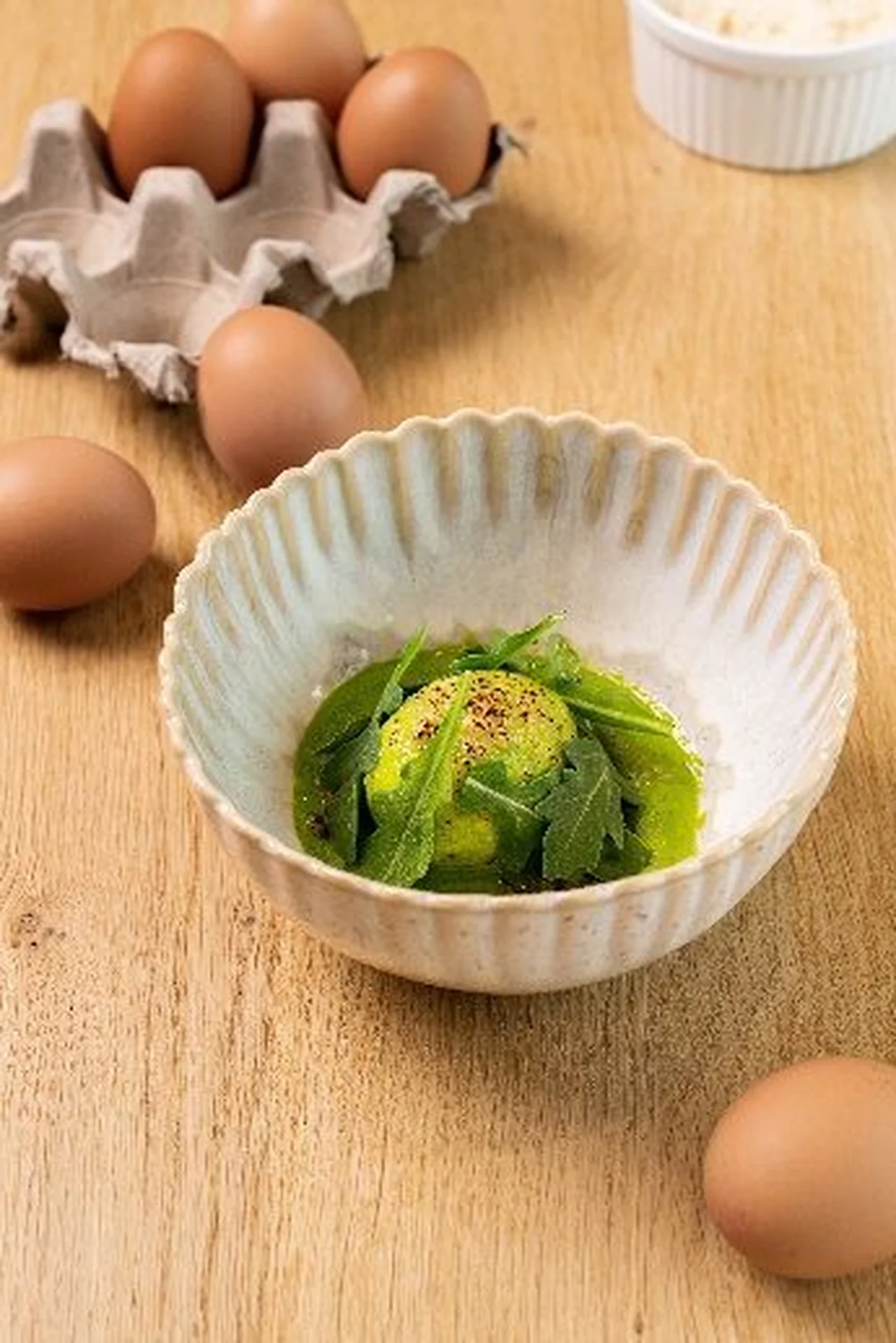 Œuf mollet au vert gratiné au parmesan